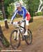 Absalon wheelies over a trail obstacle  		CREDITS:   		TITLE: Madrid World Cup XC  		COPYRIGHT: ROB JONES/CANADIAN CYCLIST.COM