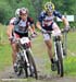 Amanda Sin and Katie Compton  		CREDITS: Rob Jones  		TITLE: Mont Ste Anne World Cup  		COPYRIGHT: ROB JONES/CANADIAN CYCLIST.COM