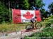 Emily Batty climbs past the flag erected by her family 		CREDITS:  		TITLE: 2013 MTB Nationals 		COPYRIGHT: Rob Jones/www.canadiancyclist.com 2013 -copyright -All rights retained - no use permitted without prior, written permission