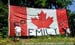 Emily Battys parents at each end of the flag erected to cheer her on to victory 		CREDITS:  		TITLE: 2013 MTB Nationals 		COPYRIGHT: Rob Jones/www.canadiancyclist.com 2013 -copyright -All rights retained - no use permitted without prior, written permissio
