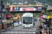Bus jammed under finish banner 		CREDITS:  		TITLE: 2013 Tour de France 		COPYRIGHT: CanadianCyclist.com